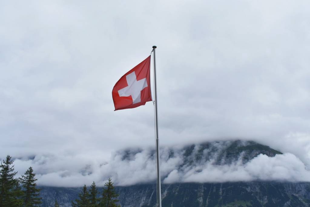 Switzerland flag during cloudy day